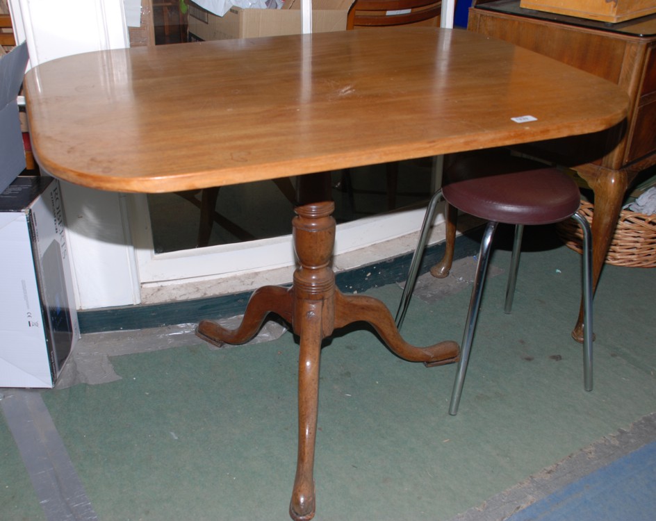 A Georgian Mahogany snap top occasional Table, rectangular one piece top with rounded corners,