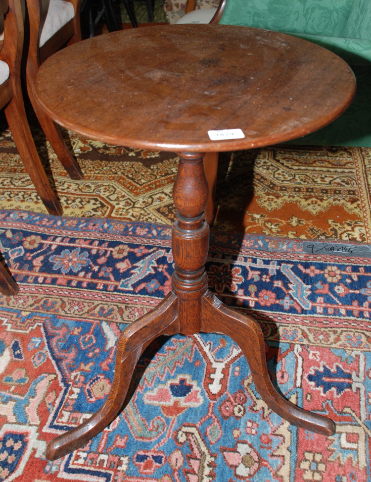 A Georgian Mahogany and Oak pedestal occasional Table having circular Mahogany one piece top,