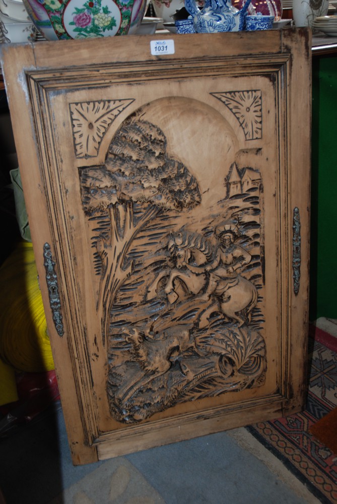 A carved French Lime door panel with hunter mounted on rearing horse hunting a deer.  20 1/4'' x