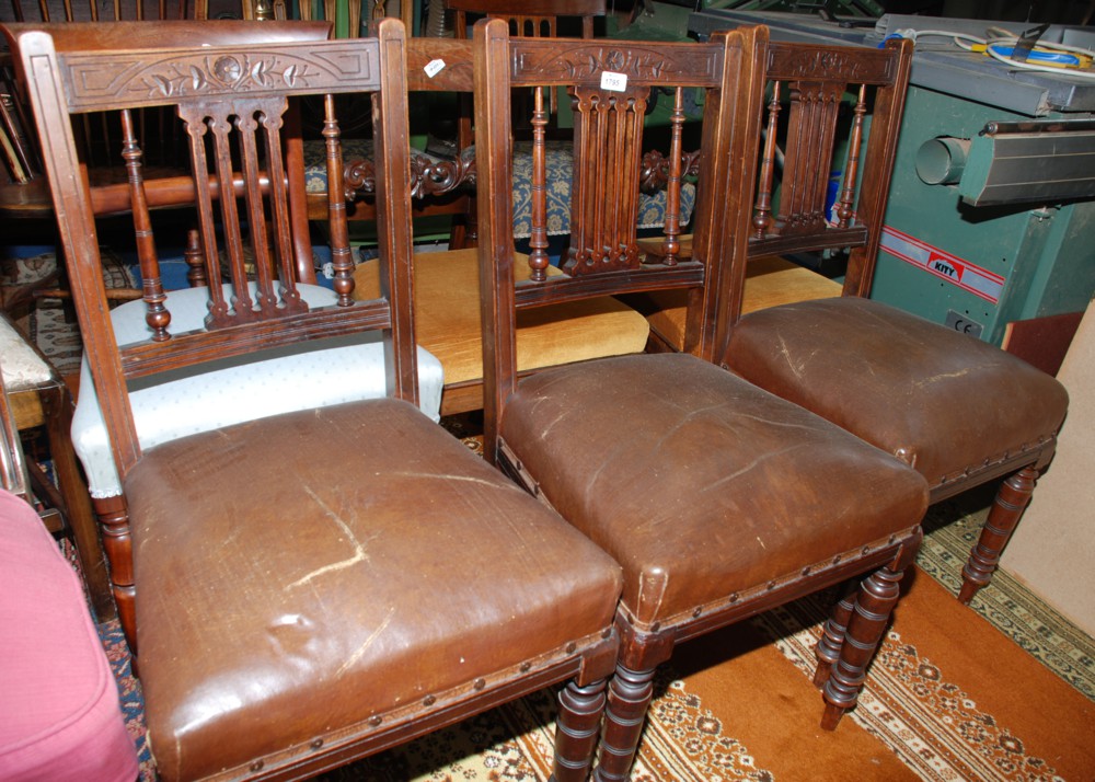 A set of three Mahogany framed Victorian Dining Chairs with pierced splat and spindle backs with