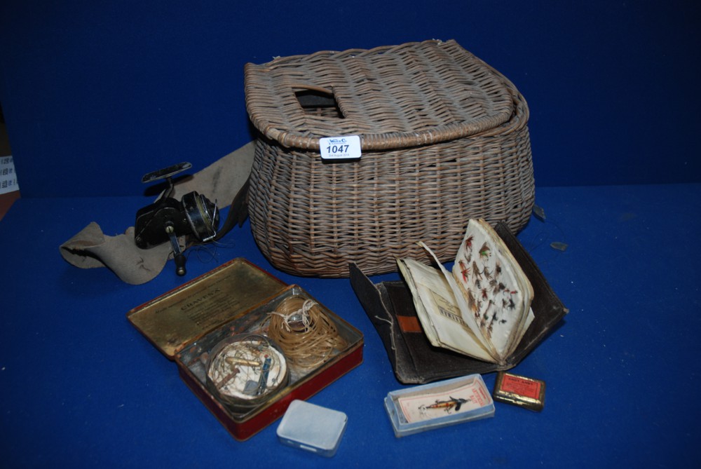 A Fishing Basket and contents, and a fly Fishing Rod