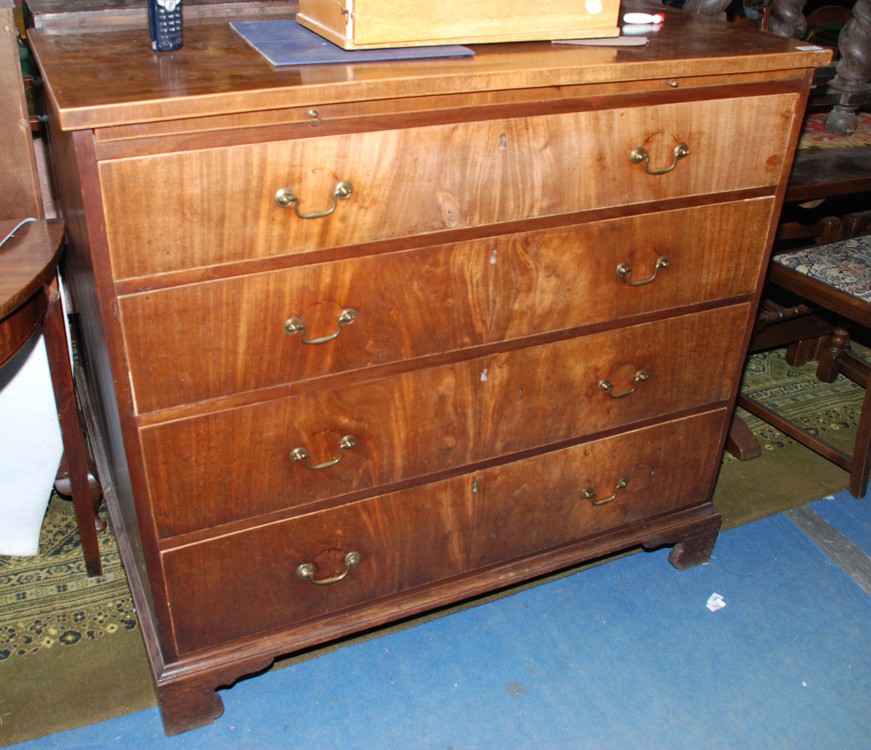 An early Mahogany Chest of four graduated Drawers with pull-out brushing slide, with brass swan neck