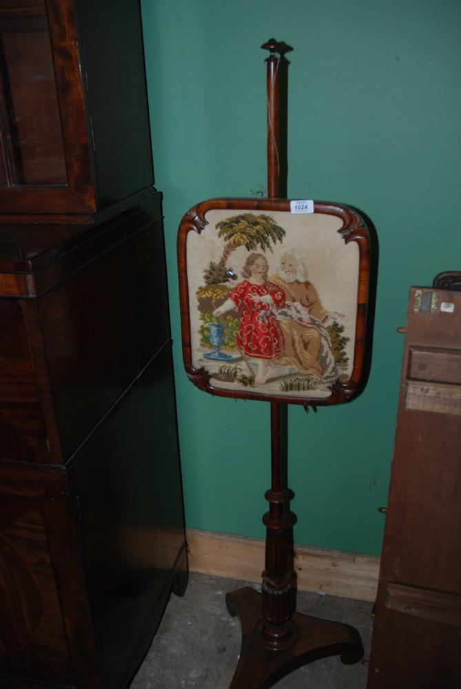 A Victorian Pole Screen with biblical tapestry scene, glass (a/f) and standing on pedestal base