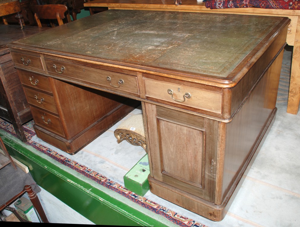 A good mid 19th c. Mahogany leather inset top Partner's Desk, having triple inset top with moulded