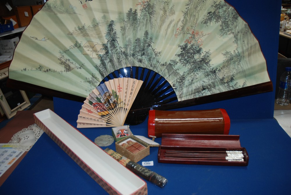 A quantity of oriental items including very large boxed fan, oriental pillow, boxed set of