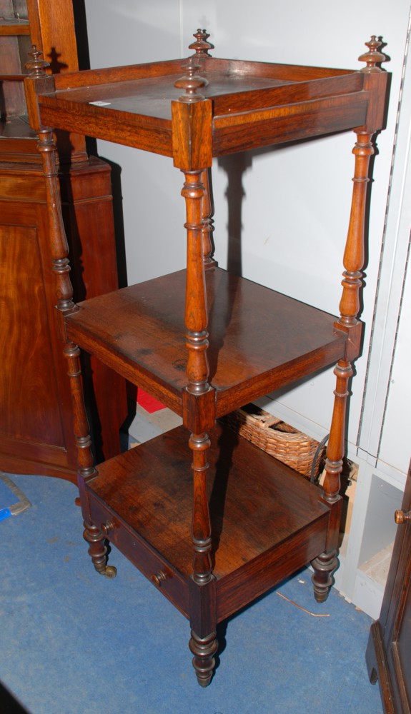 A good early 19th c. Rosewood three tier Wotnot, having gallery edge top with four turned finials,