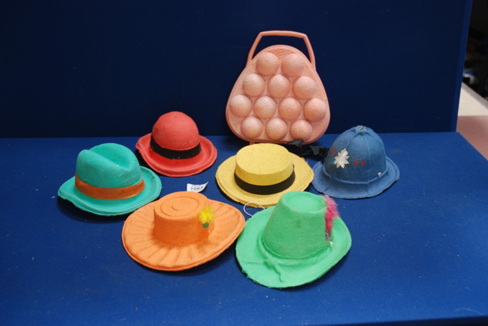Six vintage papier mache party hats and an old plastic egg basket