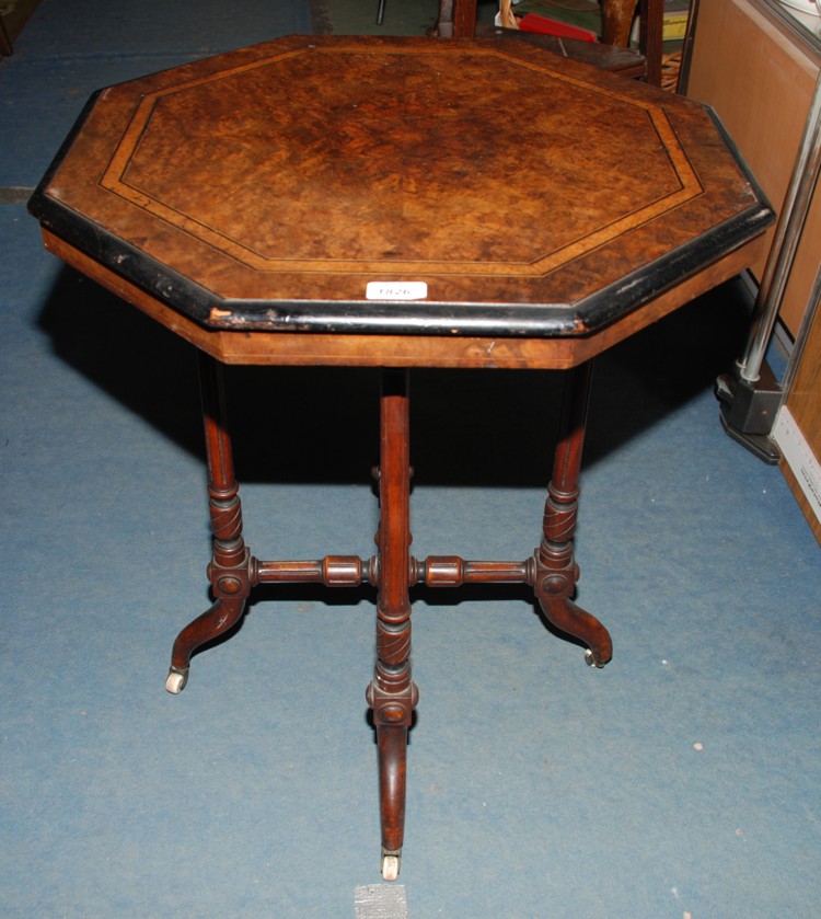 An elegant 19th c. Walnut occasional table, the octagonal top having ebony edge and strung cross