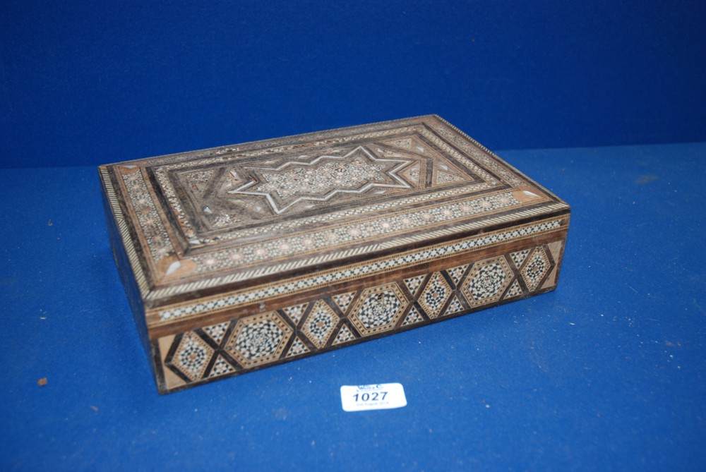 An Egyptian inlaid box profusely decorated with inlaid geometric design in mother of pearl, wood and