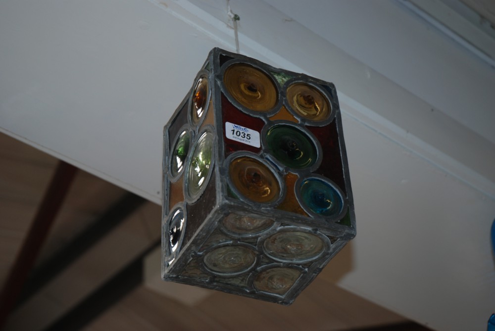 A lead coloured glass hanging Lantern Shade with brass hangers.  6'' x 8''