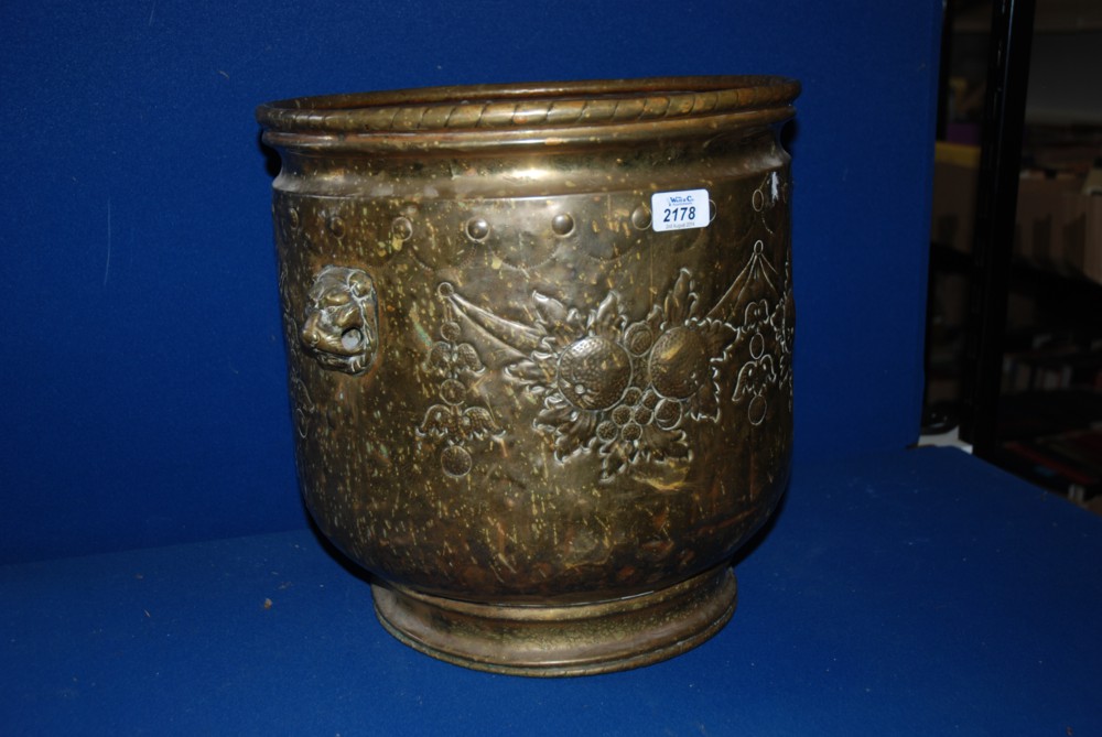 A large Brass Jardiniere with lion handle, one handle missing