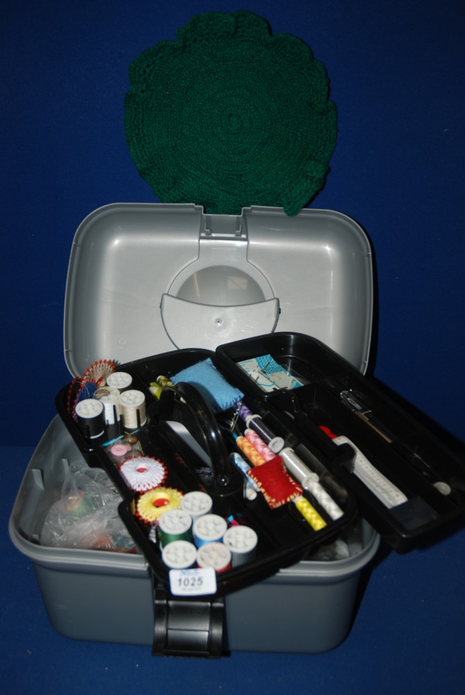 A box fitted out with sewing items including cottons, silks, etc.