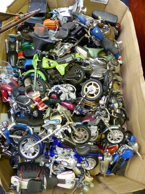 Large quantity of collectable model motorbikes and scooters including a lighter in shape of