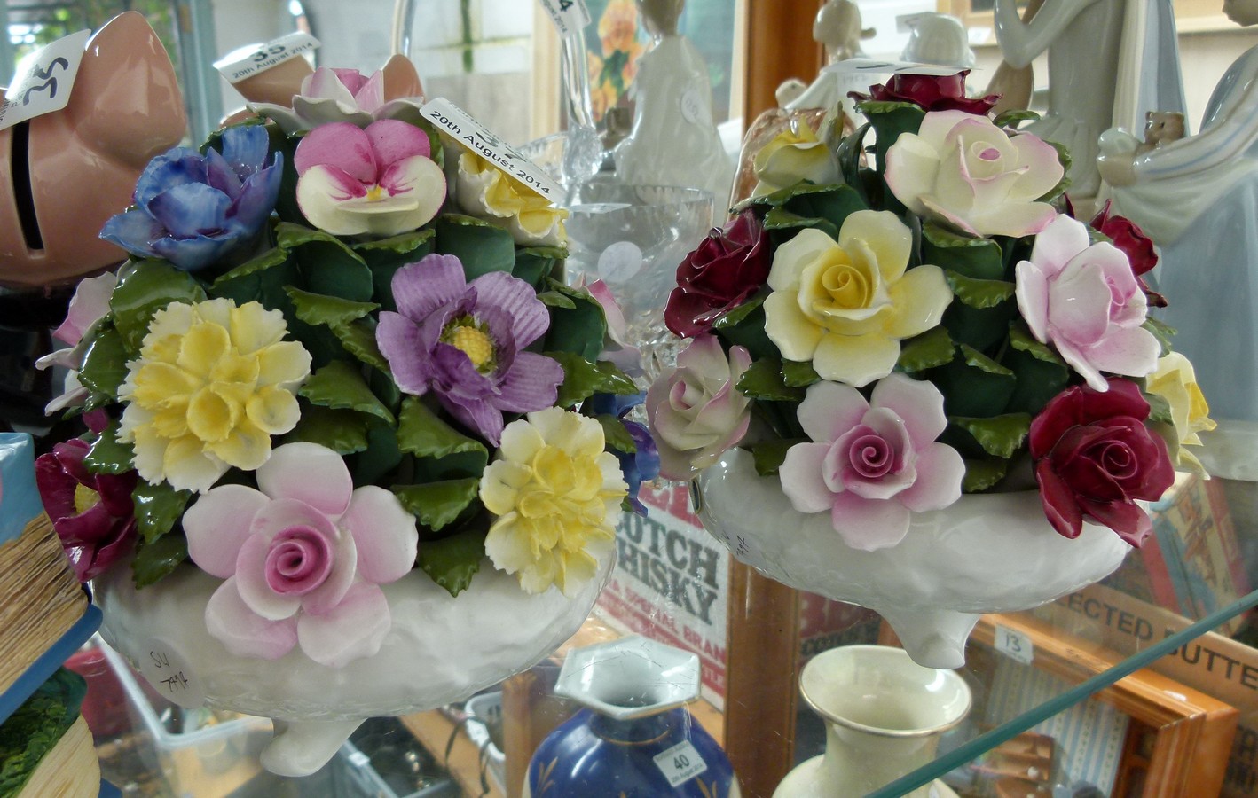 Two large Aynsley bowls of ceramic flowers, 18cm H