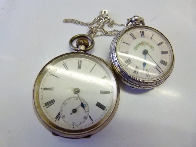 935 Silver pocket watch and a smaller hallmarked silver pocket watch on silver chain