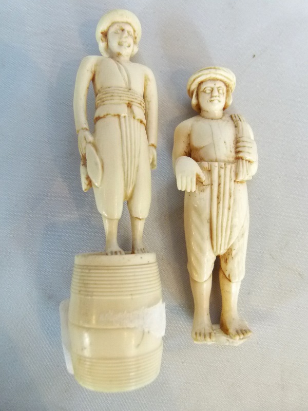 Two carved ivory figures, one with losses