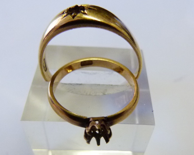 Two 18ct gold rings lacking stones, 8.3g