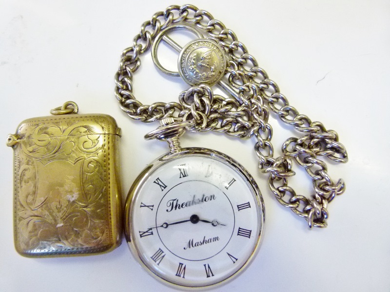 Theakston Masham crown wind pocket watch on white metal chain and a brass vesta