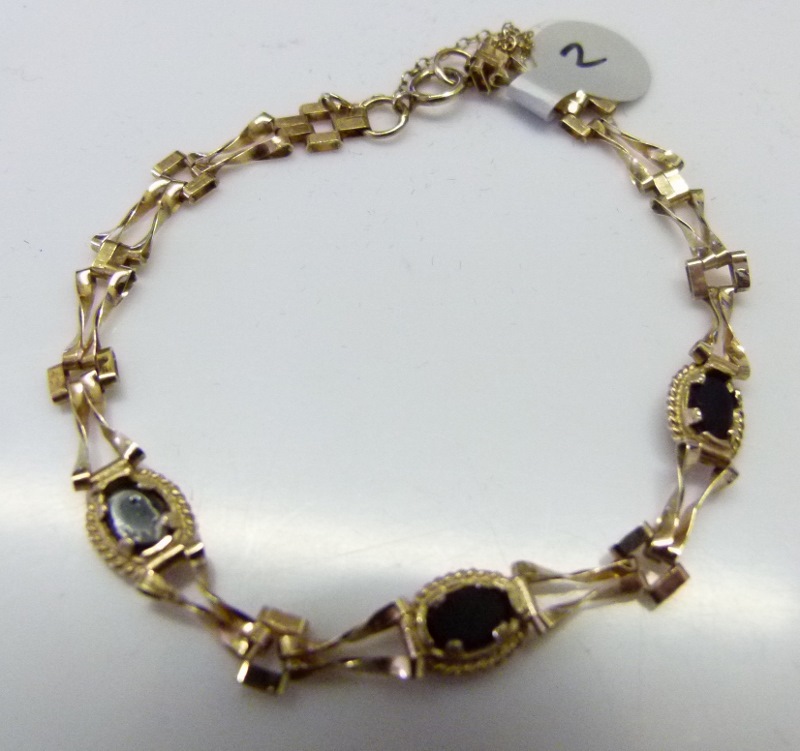 9 ct gold opal set bracelet with safety chain.