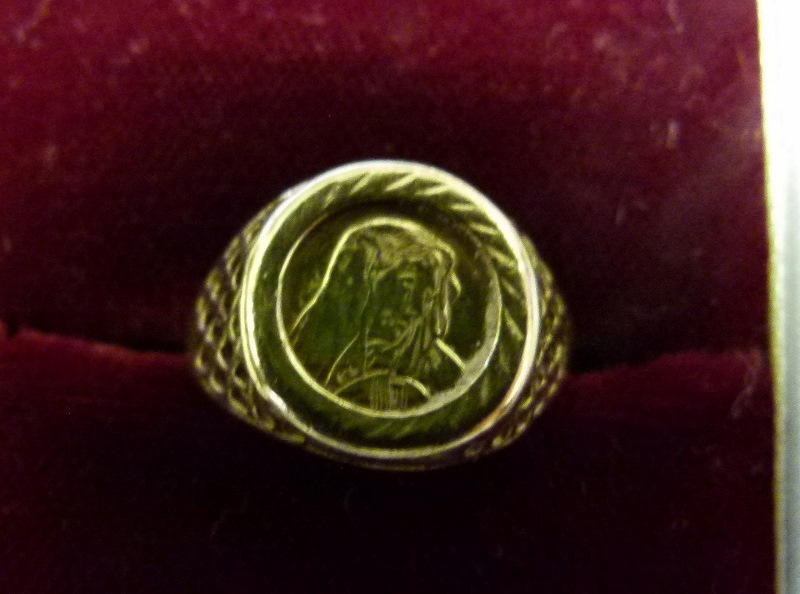 Boxed 9 ct gold  Virgin Mary ring. Size P/Q.