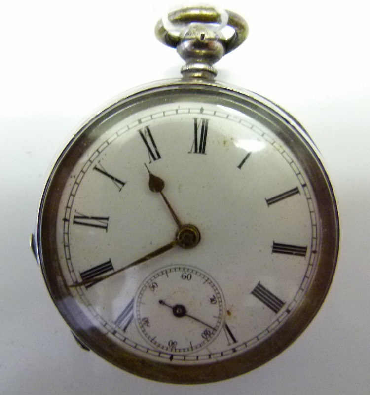 935 silver pocket watch with gold hands.