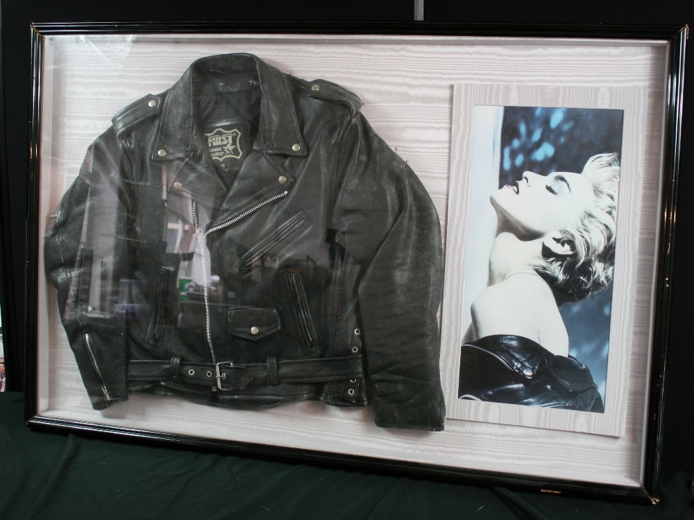 MADONNA - framed black leather biker`s jacket, similar to the one pictured in the accompanying