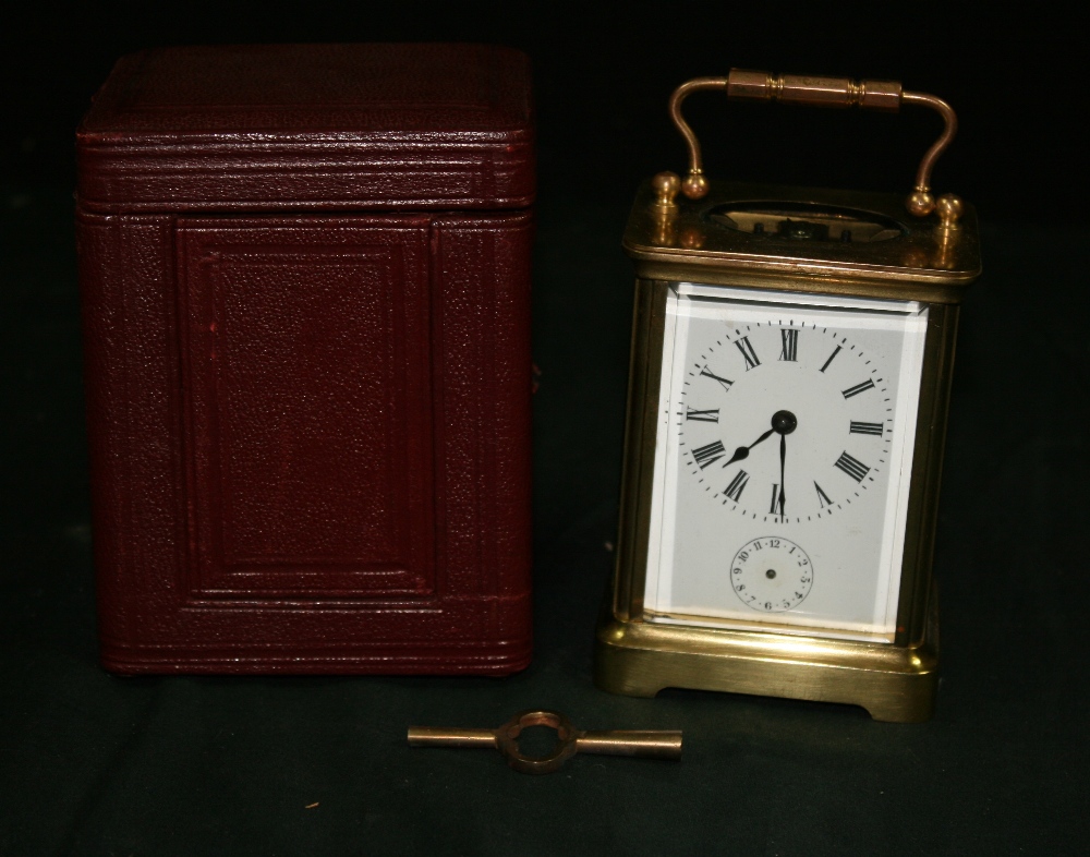CARRIAGE CLOCK - A brass carriage clock with no visible makers mark. This enamelled dial clock