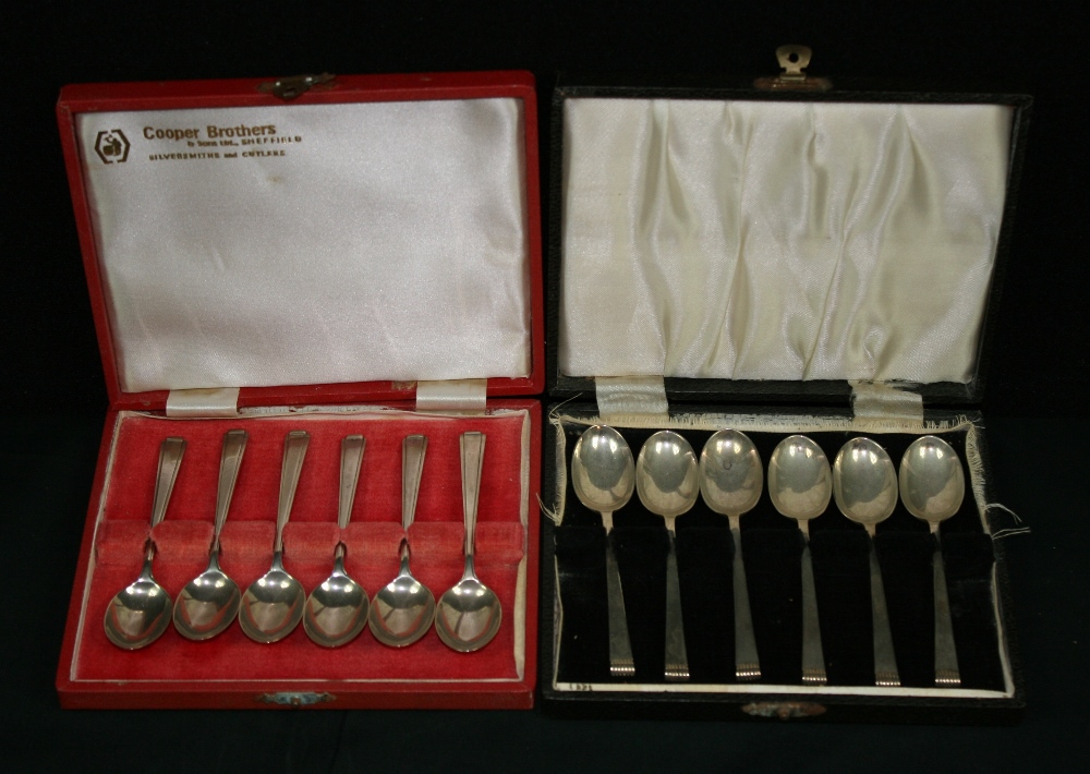 COOPER BROTHERS SILVER SPOONS -  2 cased sets of Cooper Brothers & Sons silver spoons. Each case