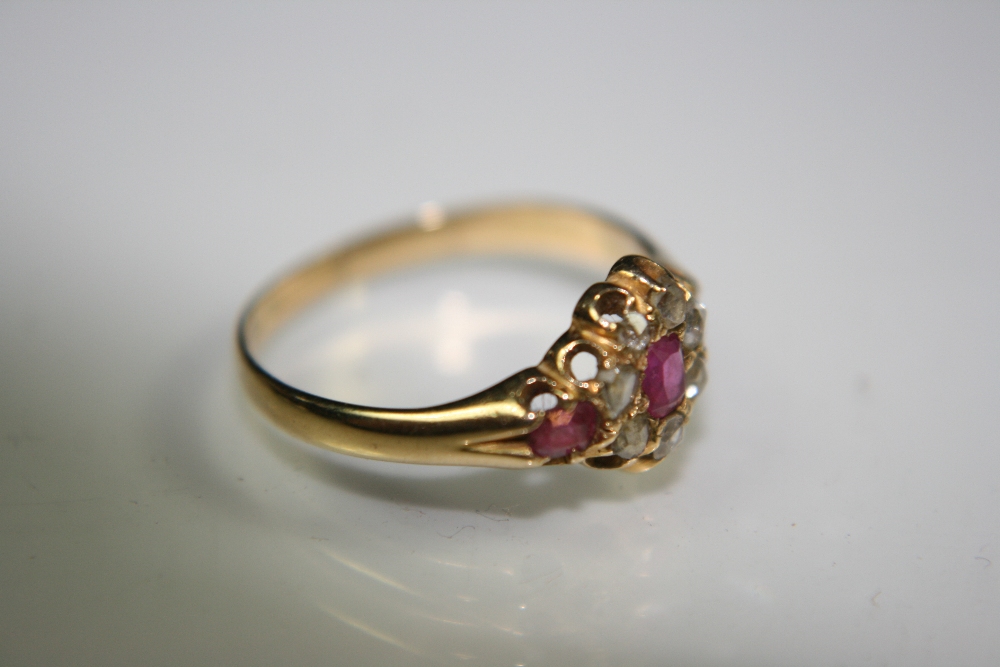 GOLD/ RUBY / DIAMOND RING - A vintage gold diamond and ruby cluster ring. 3 rubies surrounded by 7 - Image 4 of 8