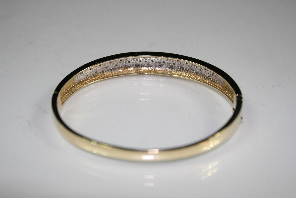 GOLD / DIAMOND BANGLE - A 9ct gold and diamond bangle in Mount Royal box. Total weight16.7g. - Image 3 of 3