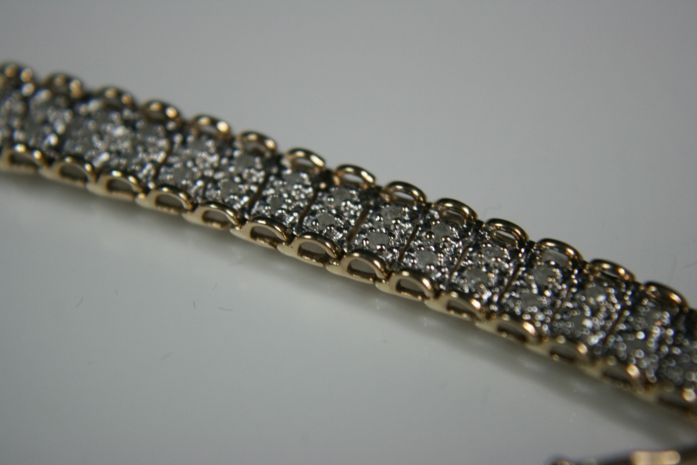 9ct DIAMOND BRACELET - attractive 9ct yellow gold bracelet with around 1.00ct of diamonds set in two - Image 2 of 3