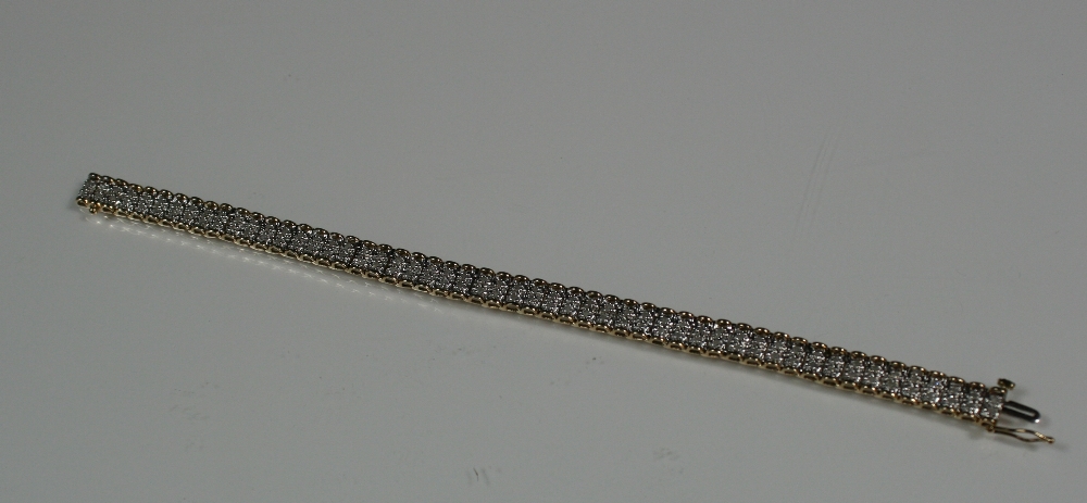 9ct DIAMOND BRACELET - attractive 9ct yellow gold bracelet with around 1.00ct of diamonds set in two