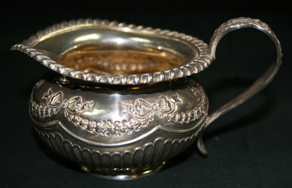 JAMES DEAKIN AND SONS - A decorative silver teapot, sugar bowl and milk jug by James Deakin and - Image 4 of 7