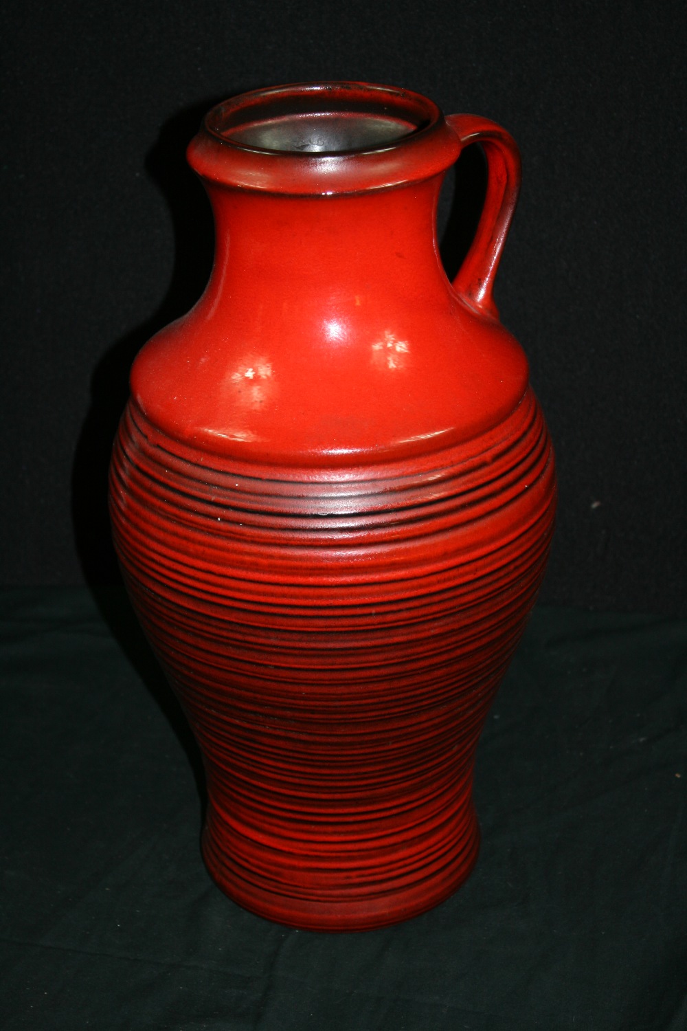 VASE - Large red glazed vase, possibly West German, with the serial number 903 13 45 stamped to