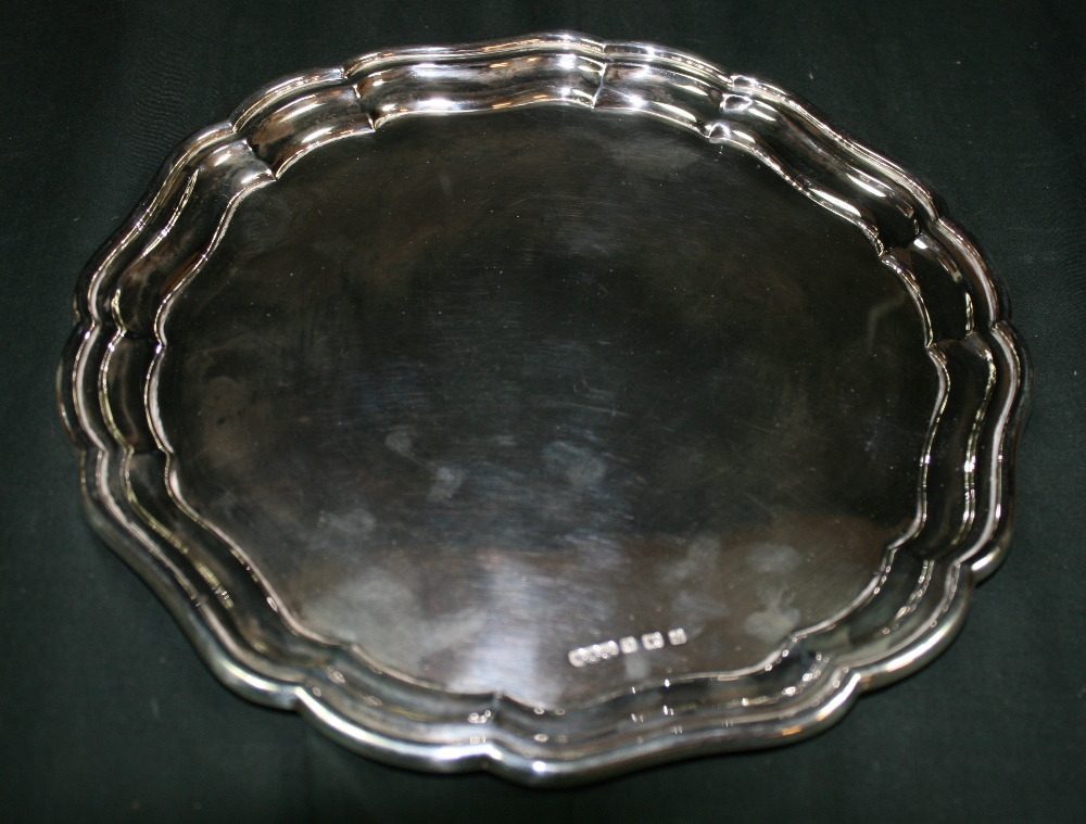 WILMOTT MANUFACTURING CO - A decorative silver salver by Wilmott Manufacturing Co. The salver has