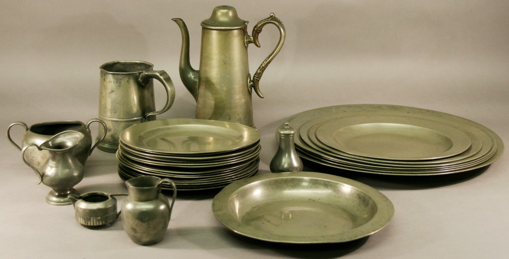 A COLLECTION OF 18TH CENTURY PEWTER PLATES AND CHARGERS of plain form, some with ownership initials