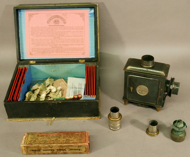 A LATE VICTORIAN GERMAN TIN-PLATE CHILD`S MAGIC LANTERN E.P Standard, Ernst Plank, housed in the