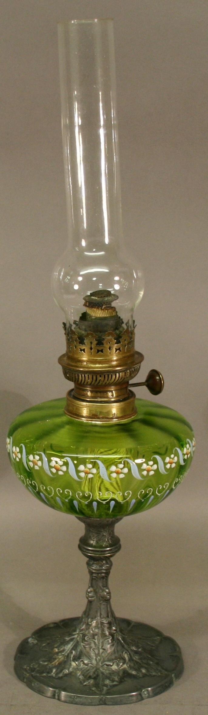 A VICTORIAN BRASS, GLASS AND PEWTER OIL LAMP, the brass burner of typical form with single