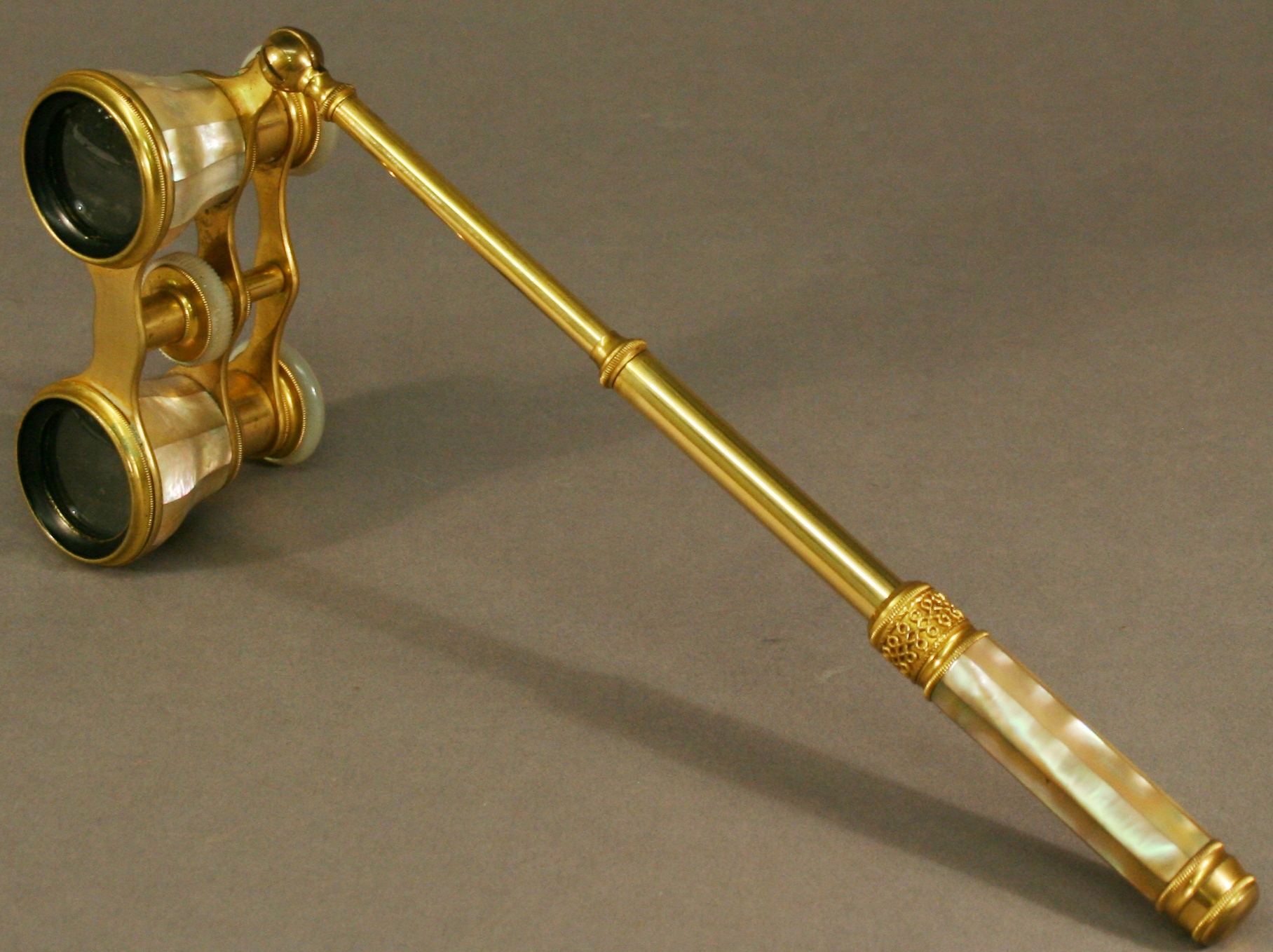 A PAIR OF FRENCH GILT-METAL AND MOTHER-OF-PEARL OPERA GLASSES by Lefils, Paris, of typical form - Image 2 of 2