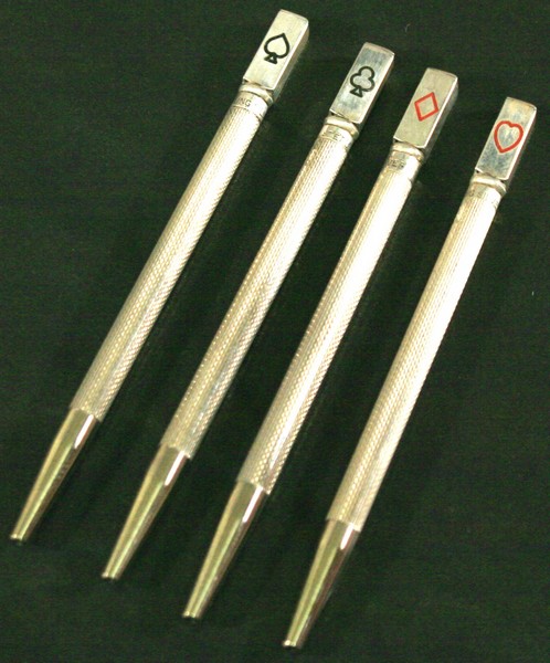 A CASED SET OF FOUR STERLING SILVER PROPELLING BRIDGE PENCILS of slender cylindrical form with