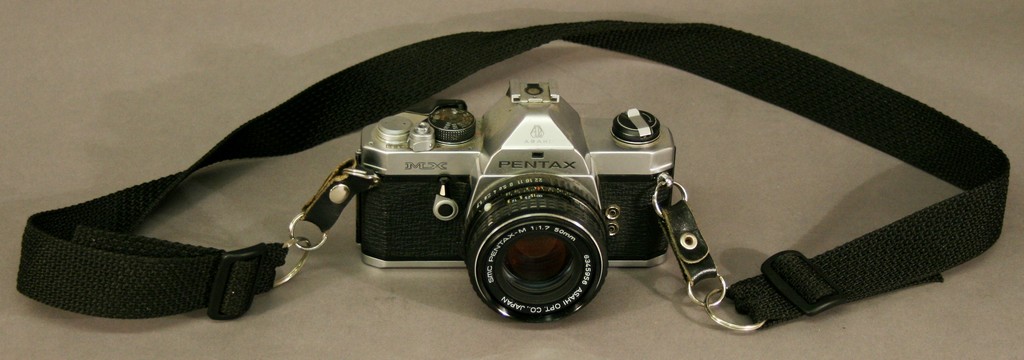 A PENTAX MX CAMERA with smc Pentax -m 1:1.7 50mm lens.  Used condition^ inspection recommended.