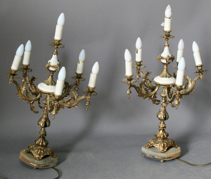 A PAIR OF GILT METAL AND MARBLE TABLE LAMPS having a central column with marble inserts and rams