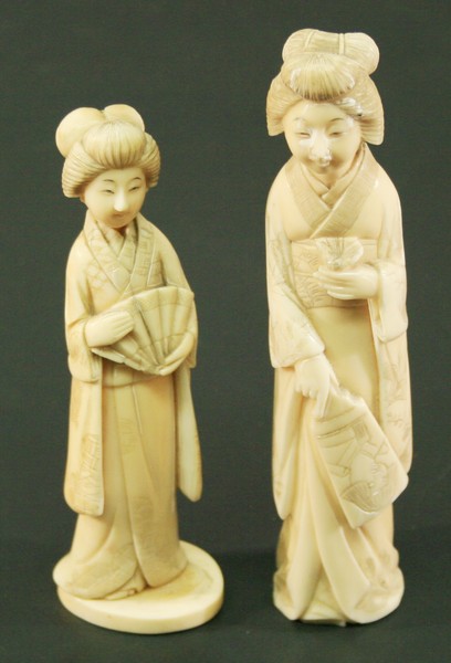 A PAIR OF JAPANESE CARVED OKIMONOS Meiji period, formed as females in traditional dress.  15.5cm &