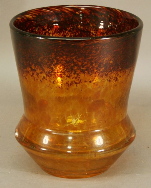 A MOTTLED ART GLASS VASE in the manner of Monart, of tapering cylindrical form with waisted base,