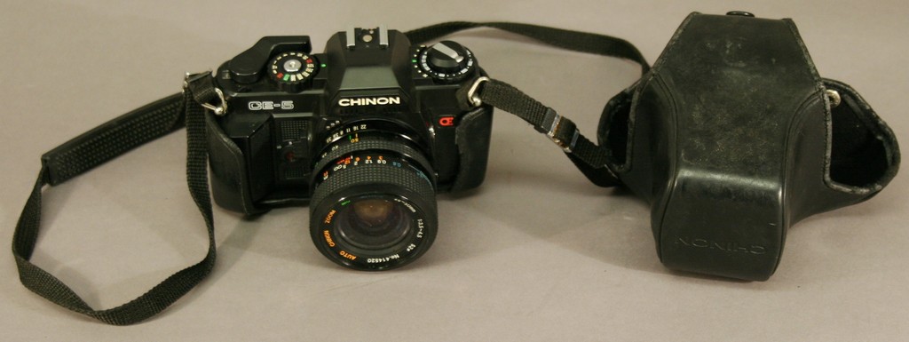 A CHININ CE-5 CAMERA with auto zoom/macro 28`50mm 1:3.5`4.5 lens and leather case.   Used