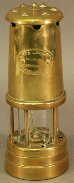 A BRASS HOCKLEY LAMP & LIMELIGHT COMPANY MINERS LAMP of typical form with applied oval plaque.