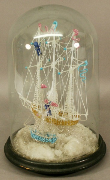 A VICTORIAN GLASS FRIGGER of a three-mast ship beside a lighthouse and smaller vessel, in spun and