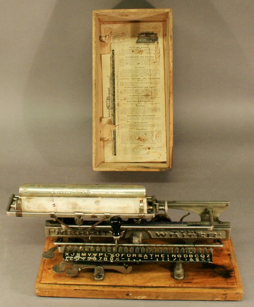 A MERRITT TYPEWRITER American c1890, number 14094 to wooden base, various patents, original wooden