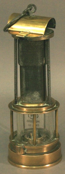 A 19TH CENTURY BRASS `CLANNY` MINERS LAMP with gauze funnel, marked `Smith Patent Odling lamp` to
