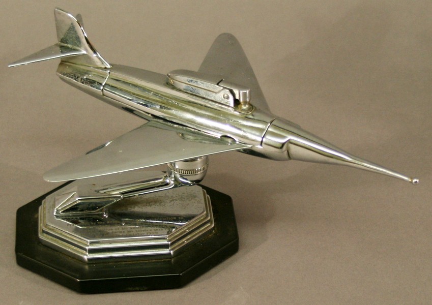 A 1950`S CHROME JET FIGHTER TABLE LIGHTER presented by The Royal Airforce Association to W H